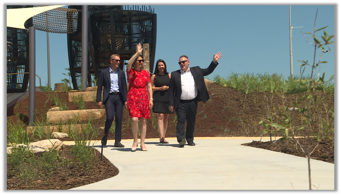 Gladys Berejiklian Adam Crouch waving at Gosford Waterfront Water Park