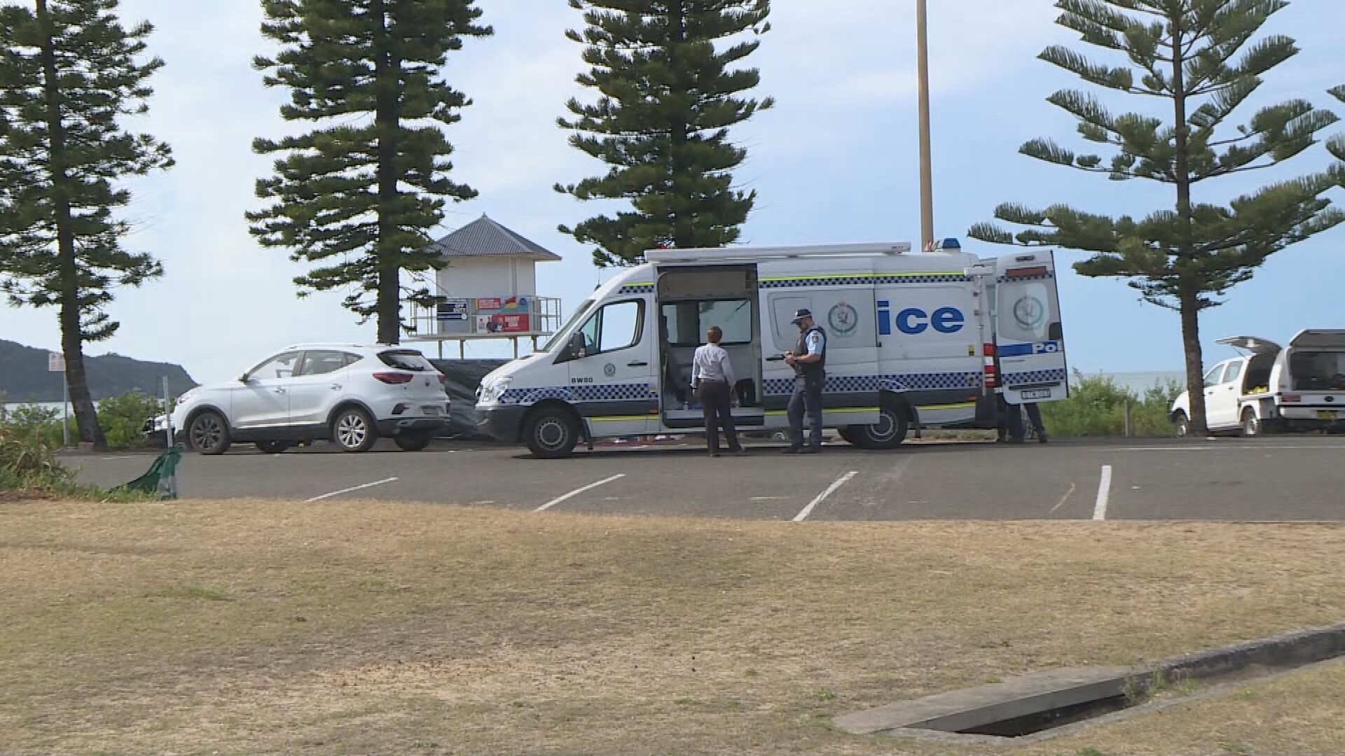 Man charged with murder after body found at beachside car park at ...
