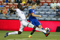 The Jets' Morten Nordstand sneaks past Victory's Jason Geria in their nil-all game at McDonald Jones Stadium, Newcastle on Monday the 13th of February, 2017.